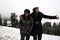 Asian thai people daughter and mother travel and posing for take photo with snow at top of mountain