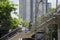 Asian thai people and foreigner traveler walking on bridge overpass traffic road go to travel and shopping at Chatuchak Market