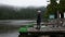 Asian thai woman travel and walking at Waterfront wooden bridge at Mummelsee lake