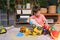 Asian  toddler boy playing with kinetic sand at home, Child playing with toy construction machinery, Montessori education,