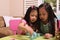 Asian toddlers playing with tea set