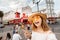 Asian tourist girl standing in front of the legendary moulin rouge cabaret theatre in