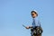 Asian tourist holding map with blue sky