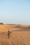 The asian tourist ride camel in Sahara desert