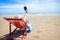 Asian tourist woman lounging on a deck chair by the sea