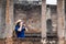 Asian tourist woman take a photo of ancient of temple thai architecture at Sukhothai,Thailand. Female traveler in casual thai