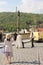 Asian tourists taking photo near Prague Castle playing battle with medieval knight reenactment scene