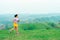 Asian trail runners, women  wearing sportswear are practicing on a high mountain running. During the evening when the air is fresh