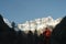 Asian trekker looking at mount jiawaren-an of the meili snow mountains, china