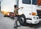 Asian Truck Driver is Checking Cargo Truck. Truck Inspection Maintenance Safety Driving.