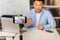 Asian Tutor Man Filming Online Lecture Via Smartphone Indoor