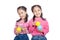 Asian twin sisters very happy playing colorful balls