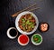 Asian udon noodles with spicy soy sauce and chicken pieces, top