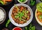 Asian udon noodles with spicy soy sauce and chicken pieces, top