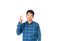 An Asian untidy man in blue plaid shirt is showing number two symbol by his fingers