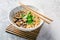 Asian vegan miso ramen noodle soup with mushrooms, onions and cilantro