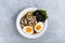 Asian Vegetarian Udon or Ramen noodles soup in bowl with Shiitake mushrooms, boiled eggs and nori sheets