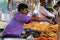 Asian vendor selling traditional sweet Jalebi/Jilapi