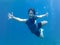 Asian woamn in snorkeling mask dive underwater
