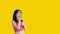 Asian woman acting shocked or surprised isolated on a Yellow background