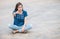 Asian woman with angry face emotion on blurred concrete floor texture background