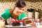 Asian woman baking chocolate cake in kitchen