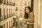 Asian woman in balcony thinking - outdoors lifestyle portrait of young beautiful and thoughtful Japanese girl at drinking morning