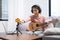 Asian woman blogger recording and live steam playing guitar on social media