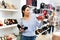 Asian woman buying new footwear in shoe store