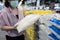 Asian woman choosing white rice while shopping dry food at supermarket,female people buying and hoarding rice during returning of