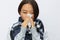 Asian woman cold flu holding a handkerchief stuffed nose with fever sick from the virus on a white background, copy