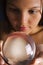 Asian woman with crystal ball