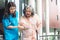 Asian woman doctor shook hands, encouraged and supported elderly woman patient