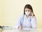 Asian woman doctors provide telephone counseling in health care,new normal and coronavirus protection concept