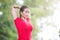 Asian woman doing stretching exercise during outdoor cross train