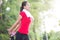 Asian woman doing stretching exercise during outdoor cross train