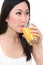 Asian Woman Drinking Orange Juice