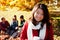 Asian woman drinking a warm drink