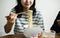 Asian woman eating an instant noodle