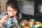 Asian woman eating soup with a spoon dumplings on restaurant