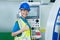 Asian woman engineer worker wear hard hat and showing thumb up in factory