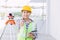 Asian woman engineer worker work in construction site. Smart builder architect female in safety suite working