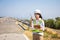 Asian woman engineers are using walkie-talkies and tablet outdoors on site power plant energy