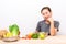 Asian woman enjoy eating salad vegetable