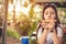Asian woman enjoy eating slice of pizza at outdoors. Happiness after diet concept.  People lifestyle and Italian food concept.