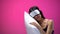 Asian woman in eye mask sleeping on pillow, resting after hard day, silence