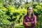 Asian woman farmer in longan orchard