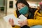 Asian woman flying in covid19 times - lifestyle portrait of young beautiful and tired Chinese girl in face mask waiting on airport