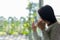 Asian woman fresh morning drinking coffee and looking out of the window on sunny day