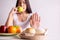 Asian woman hands stop to bread and holding green apple on white background,Healthy diet,Dieting concept